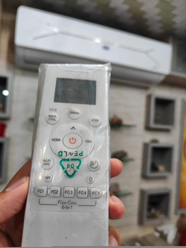 Carrier 1.5 Ton 5 Star Flexi Cool 6-in-1 AC remote control showing Mode, Fan, Swing, Insta Cool, Step, Wi-Fi Opt, and FC1 to FC6 convertible cooling function buttons